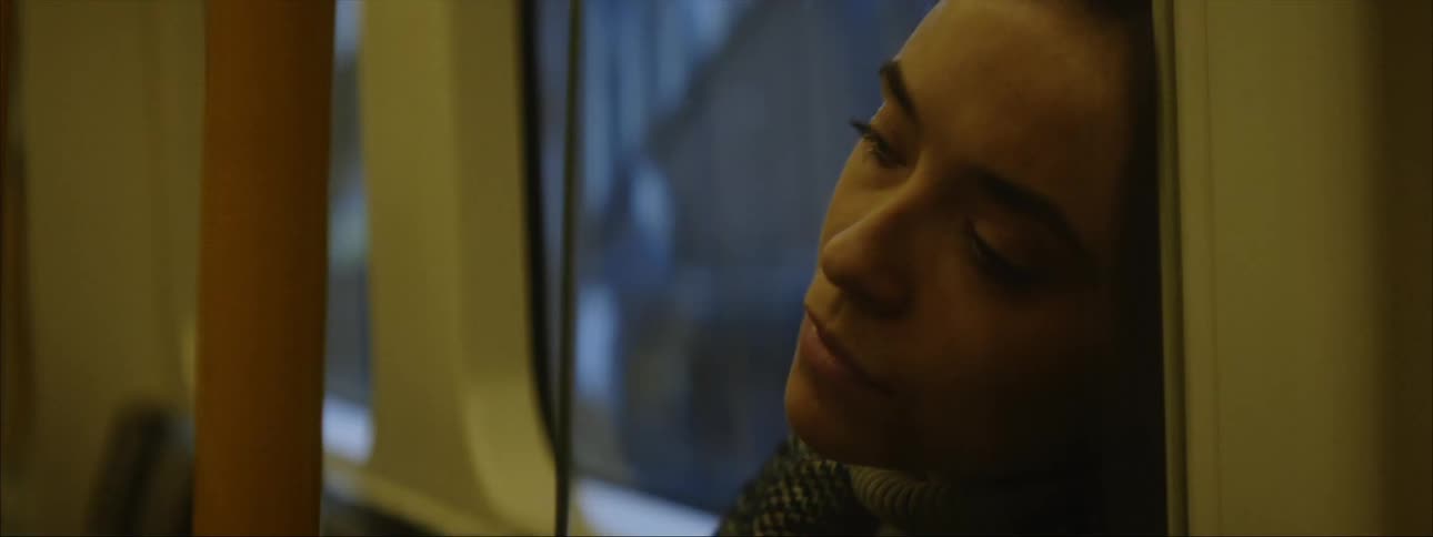 A young woman is sleeping on the bus in the day time