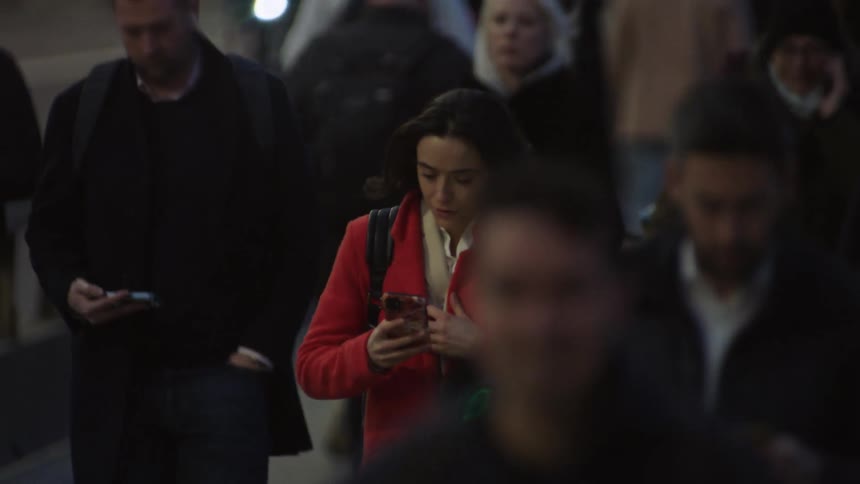 Pedestrians walk in the city