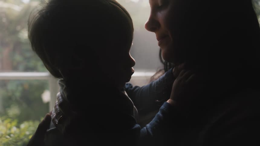 A mother is holding her child