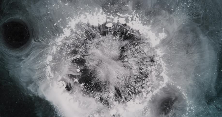Pale vapor expands and contracts at center and around holes