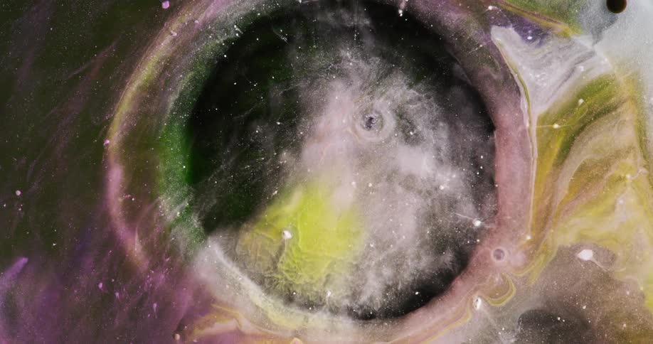 A translucent liquid substance opens like a vortex and ripples exposing a nebula and stars