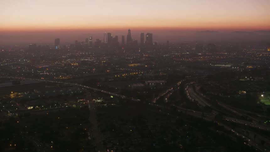 A large city at dawn skyscrapers on the horizon