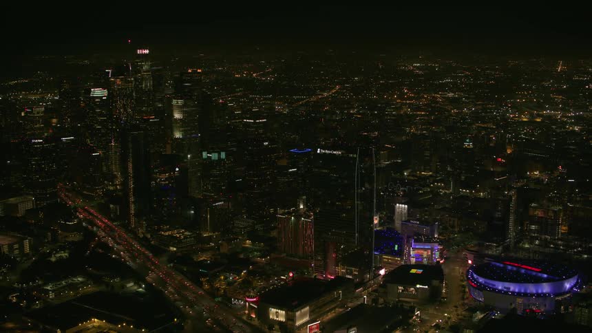 Aerial view of traffic driving through a downtown city