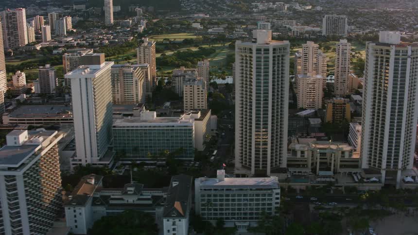 Drone view of a large metropolis city along a coast line with tall buildings