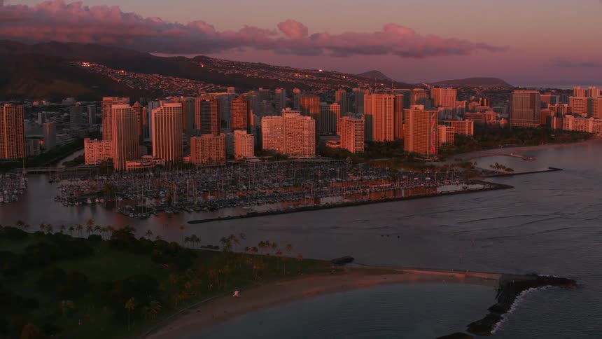 A coastal city with a large marina at dawn