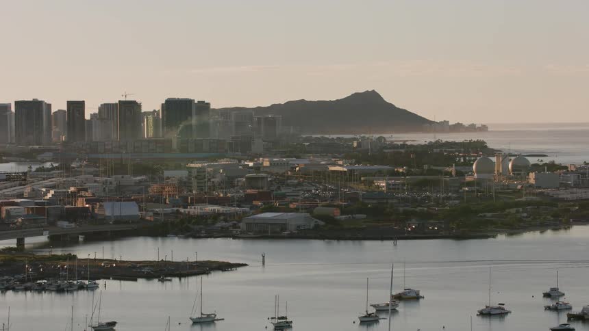 Drone view of boats in the marina and a metropolis city on the coast of the ocean