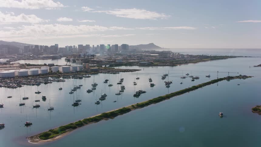 The view is of the ocean and you can see some buildings