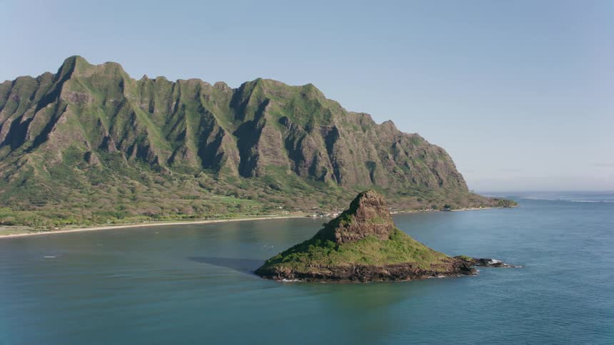 Aerial view of an island in the middle of the ocean water