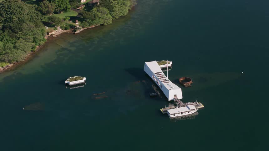 People hang out on a floating building off the coast