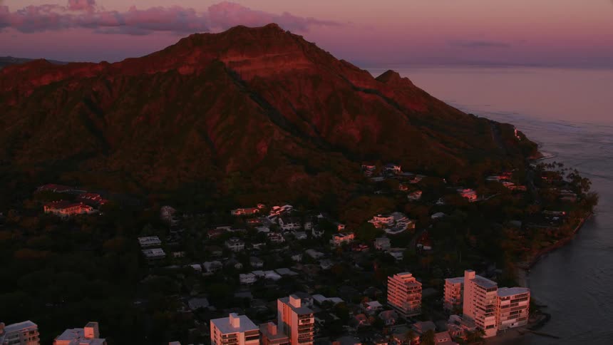 The sun is setting on the coastal city