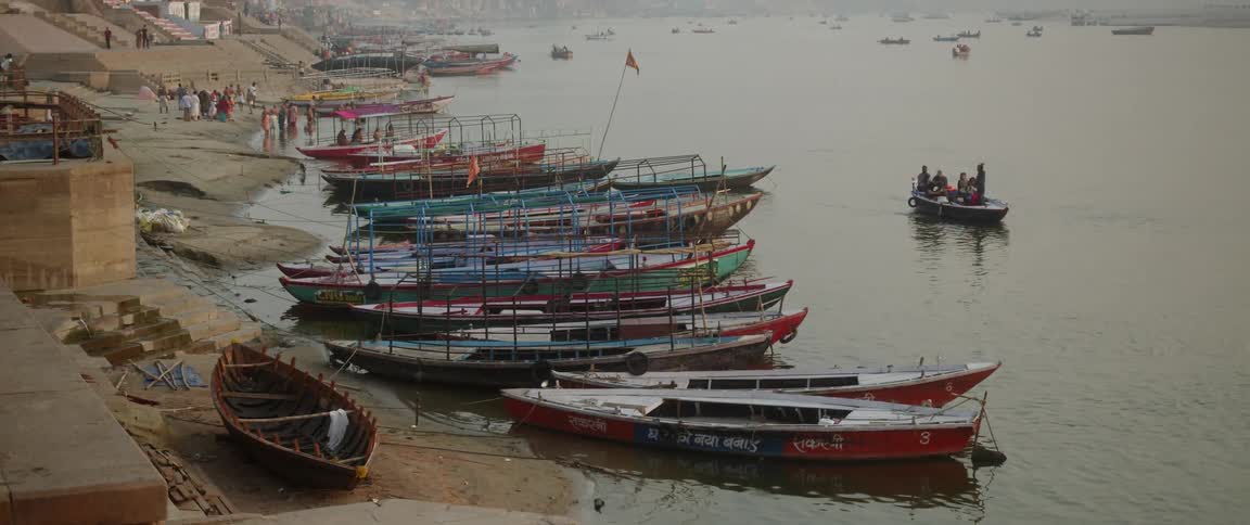 Several boats laying at anchor in the harbour
