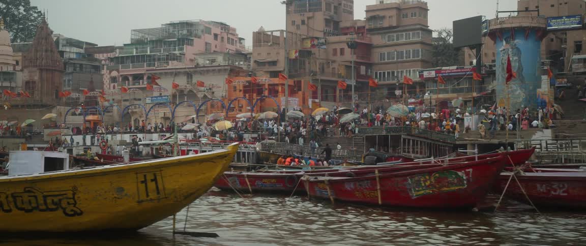 Many boats are anchored by the city