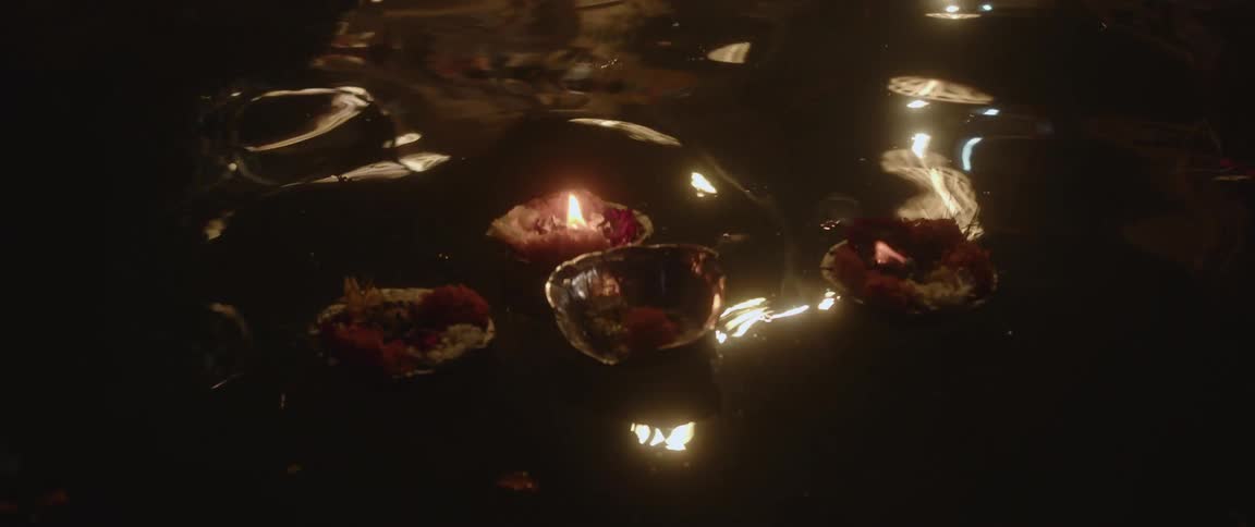 Bath water is sprinkled with rose petals