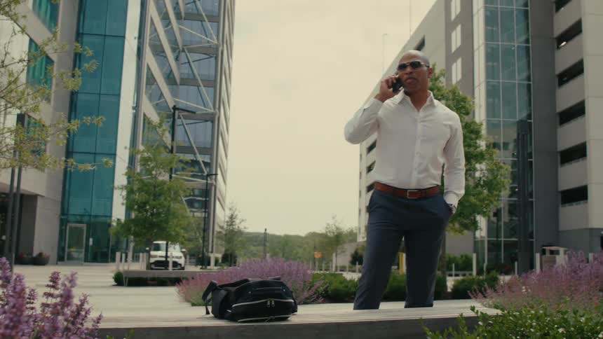 Man talking on his cellphone in a downtown city