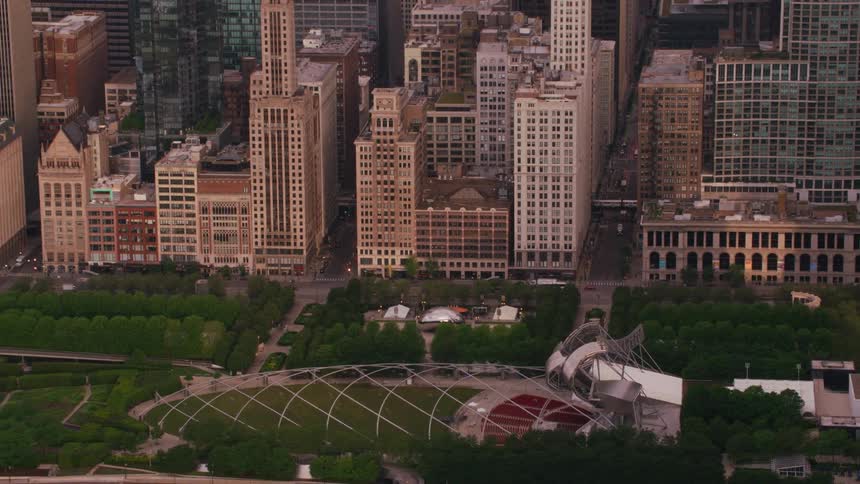 A tree park in a city surrounded by skyscrapers