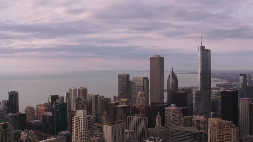 Skyscrapers of varying heights fill a city skyline