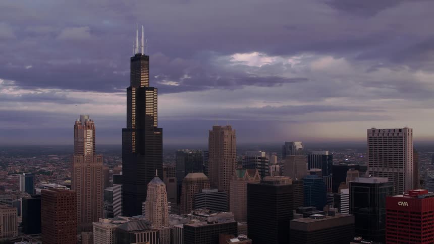 Skyscrapers of varying heights fill a city skyline