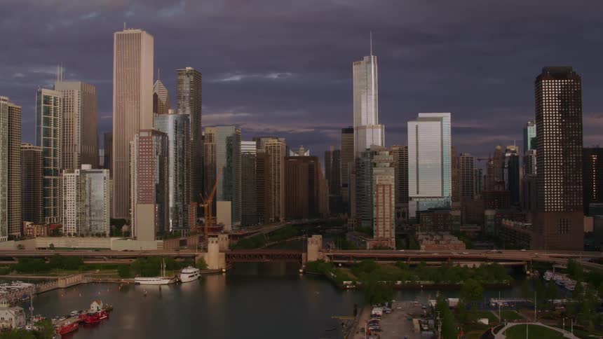 Aerial view of high rise buildings and skyscrapers near river in the city