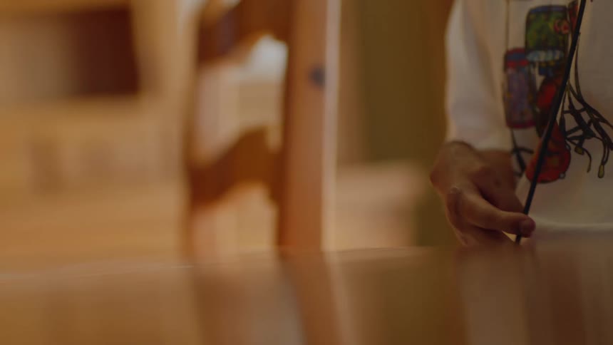 Disabled man with white t shirt sits at table