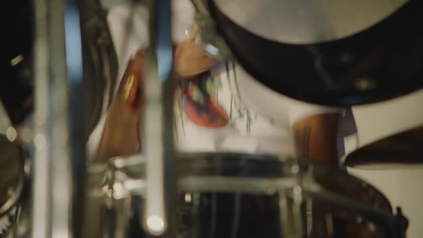 A disabled man plays the drums