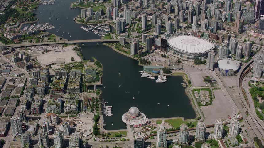 A bay with a marina in the middle of a big city