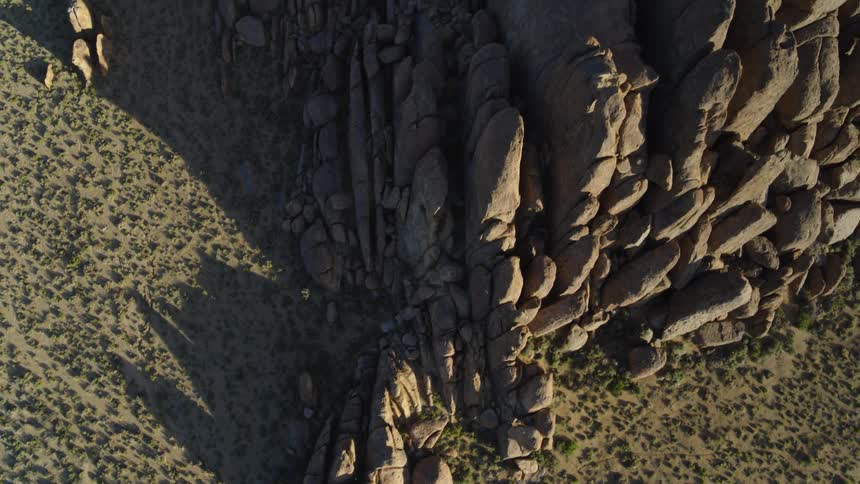 Craggy mountains tower over arid scrubland