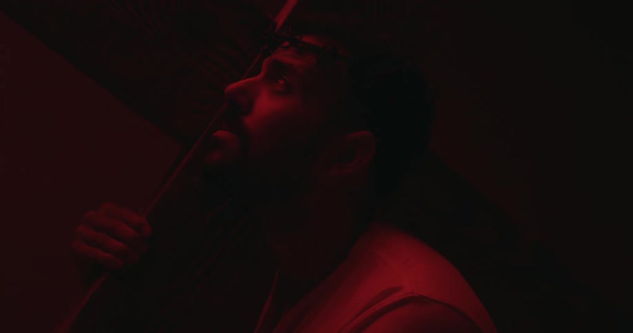 A man slowly looks up