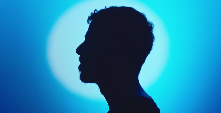 The mans head is in the dark