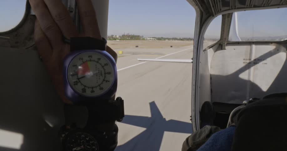 The view is of someone in a plane outdoors in the day time