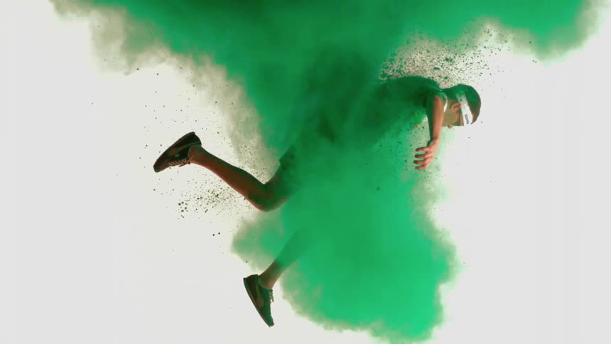 A man is pulled up through a cloud of green powder