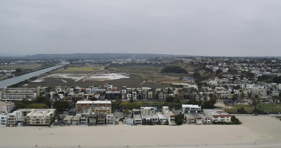 Beach homes sit in neat rows on the sand