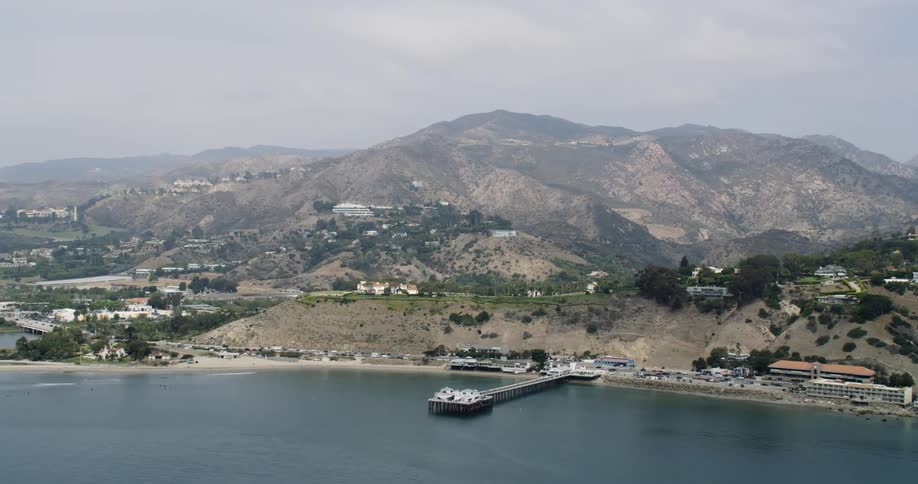 Aerial view of buildings in mountainous area and coast