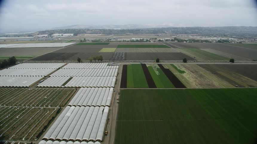 Aerial view of greenhouses and farmlands