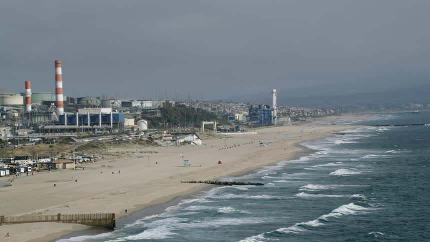 Aerial view of people on the beach near the ocean