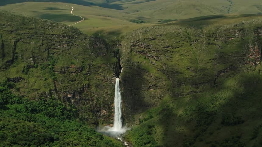 Aerial view of waterfall cascading down the mountainside