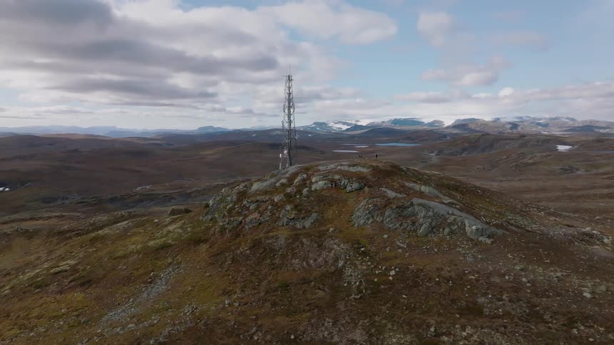 Aerial view of radio station tower on mountain