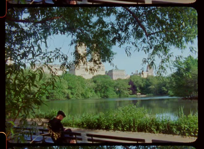 An older man is sitting down around the nature area