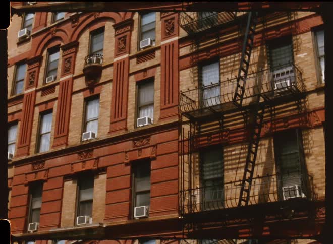 Exterior view of apartment building with fire escape
