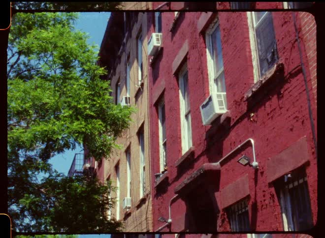 Exterior view of apartment building with fire escape