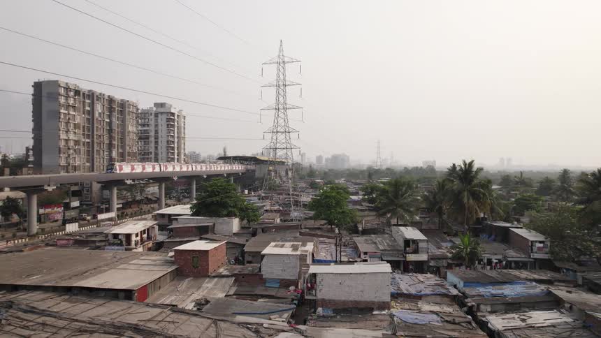 The view is of the downtown area and you see a train going by
