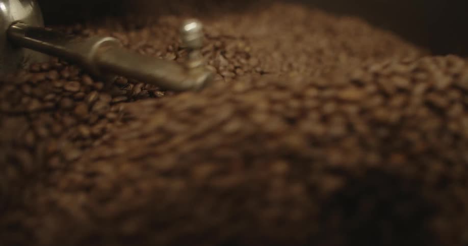 Coffee beans are being roasted in coffee roasting machine