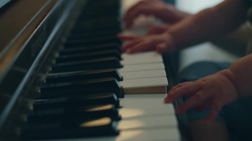 The view is of someone playing the piano inside of there home
