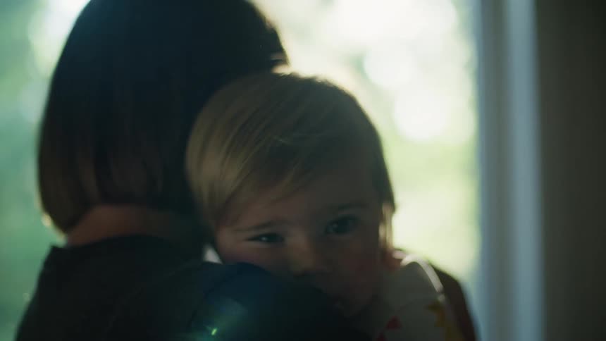 A woman his holding her child