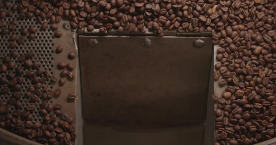 The view is of coffee beans in a factory during day time