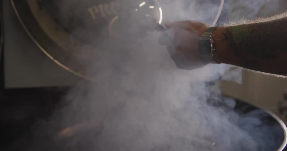 A roaster pour coffee beans into coffee roasting machine to roast