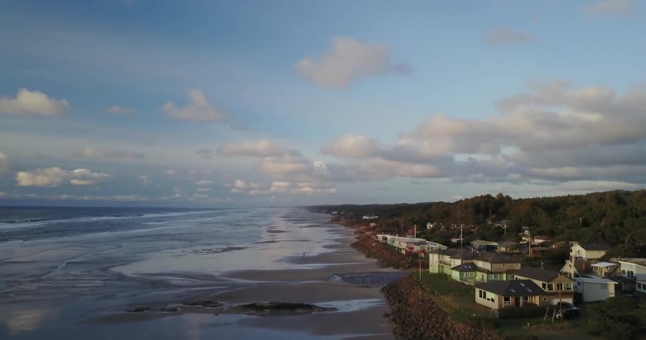 The coast line has houses near the water