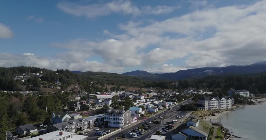 An ocean side town on cloudy day