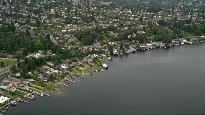 Aerial view of large lakeside homes with personal boat docks in Rainier Beach Washington