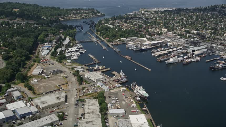 A stunning aerial view of Seattles Salmon Bay showcasing waterfront warehouses and canal locks