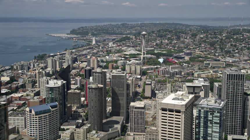 A breathtaking aerial view of the Space Needle towering above downtown Seattles vibrant skyline